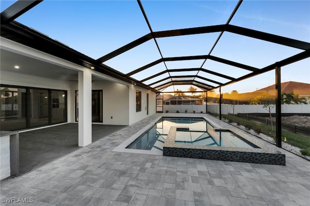 view of swimming pool featuring a fenced in pool, a lanai, a patio, and fence