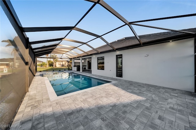 outdoor pool featuring a patio area and a lanai