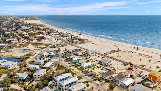 aerial view with a water view and a view of the beach