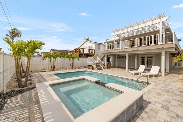 view of swimming pool featuring french doors, a fenced backyard, a pergola, and a patio area