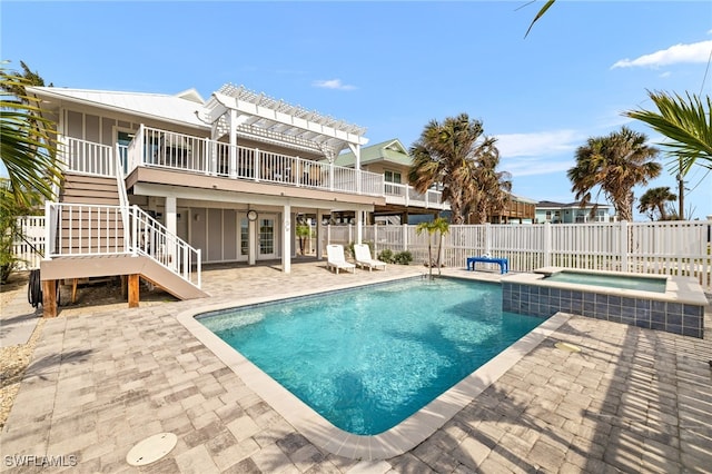 view of pool with a patio area, stairway, fence, and a pergola