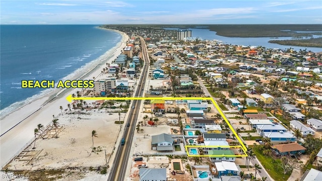 aerial view with a view of the beach and a water view