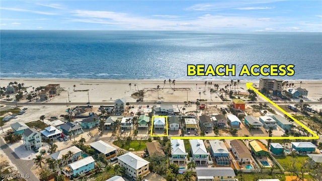 bird's eye view featuring a view of the beach and a water view