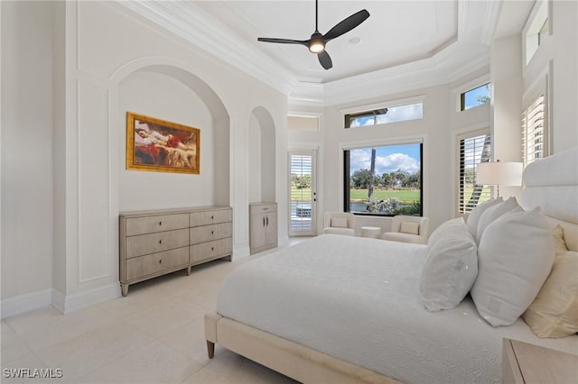 bedroom featuring light tile patterned floors, a raised ceiling, ornamental molding, access to outside, and baseboards