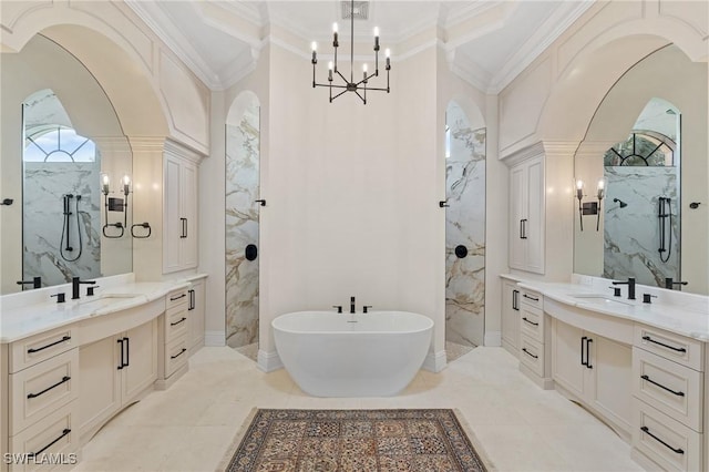 full bath with a marble finish shower, ornamental molding, two vanities, and a sink