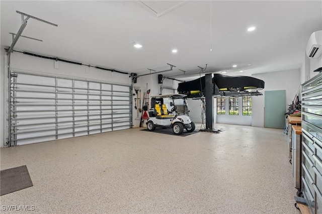 garage featuring a wall mounted air conditioner