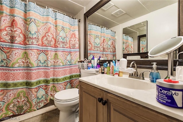 full bath with toilet, tile patterned floors, visible vents, vanity, and a shower with curtain