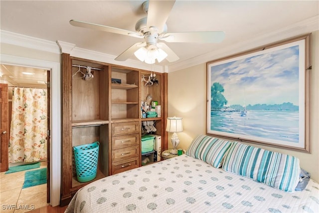 bedroom with a closet, a ceiling fan, and crown molding