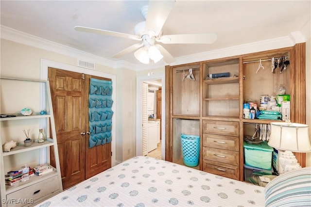 bedroom with ceiling fan, visible vents, crown molding, and ensuite bathroom