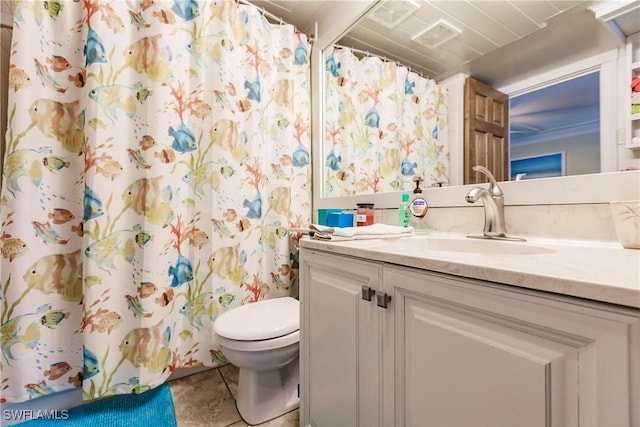 bathroom featuring toilet, visible vents, vanity, a shower with curtain, and tile patterned floors