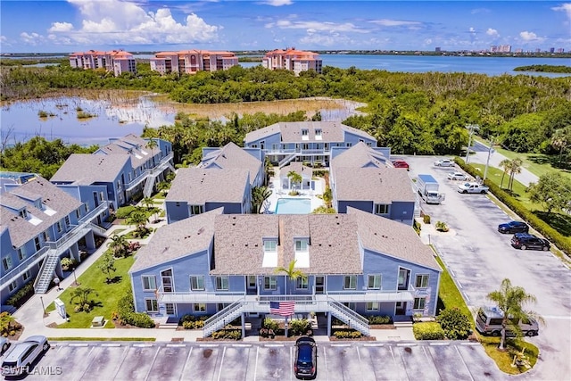 aerial view with a water view and a residential view