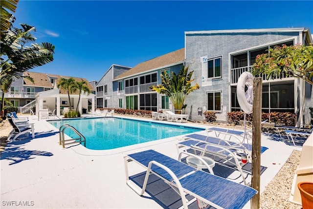 community pool featuring a patio area