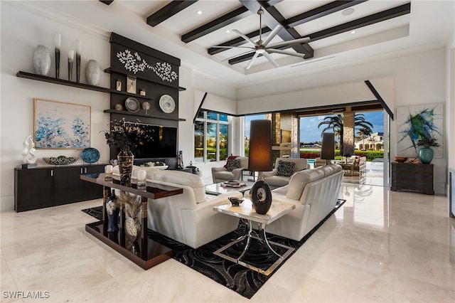 living area with marble finish floor, beam ceiling, a towering ceiling, a ceiling fan, and coffered ceiling