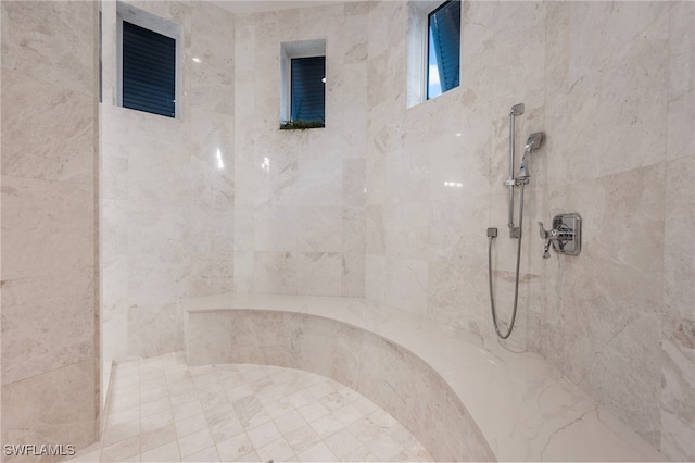 bathroom featuring tiled shower