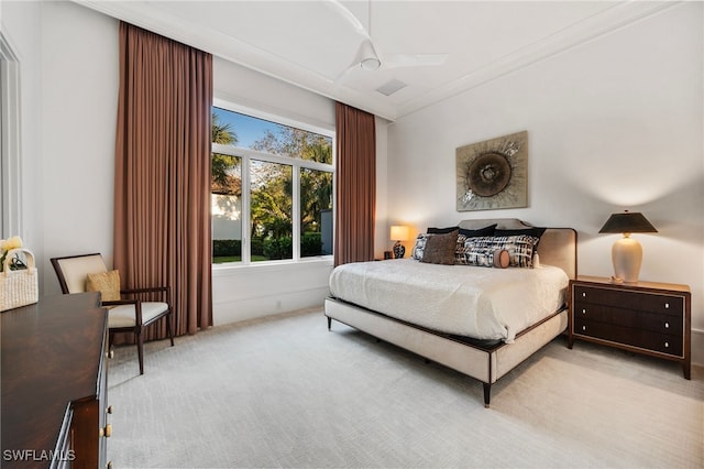 carpeted bedroom with ornamental molding