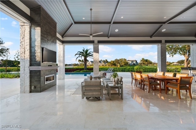 view of patio / terrace featuring outdoor dining space and an outdoor pool