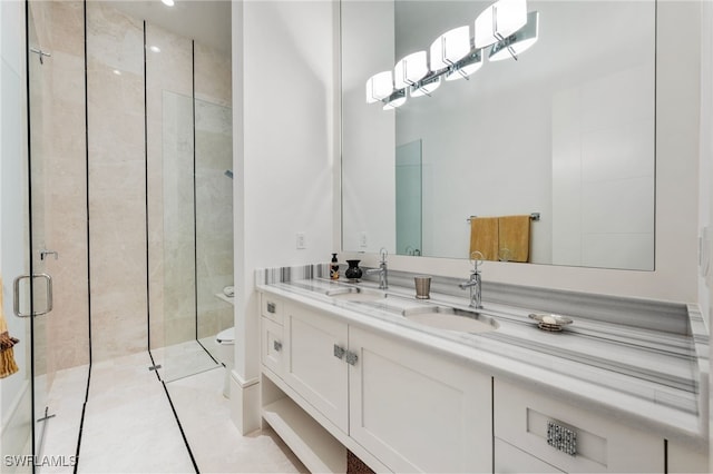 bathroom featuring tile patterned flooring, toilet, a sink, double vanity, and a stall shower