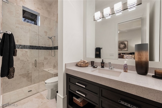 full bath featuring vanity, a shower stall, and toilet