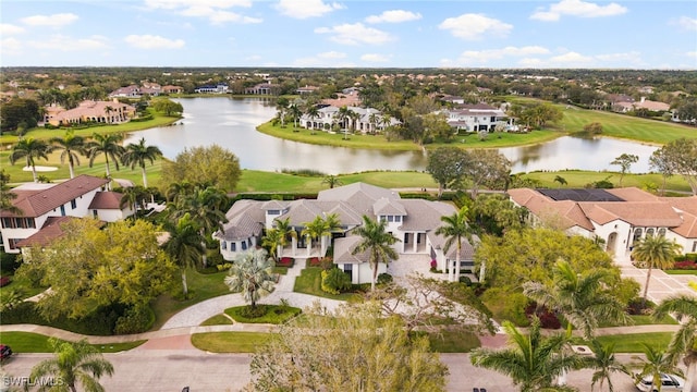 birds eye view of property featuring a water view, a residential view, and golf course view