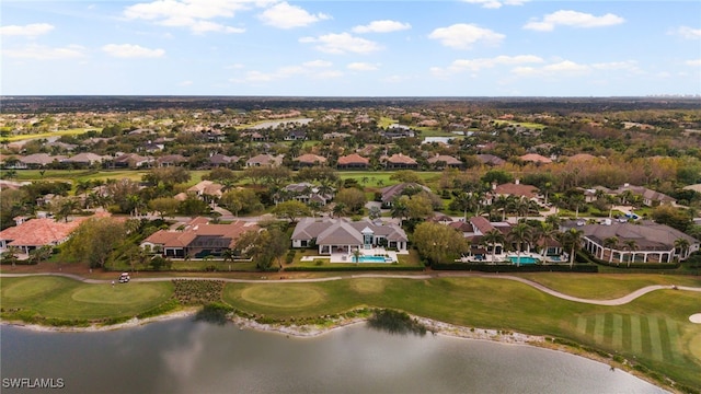 aerial view featuring golf course view, a water view, and a residential view