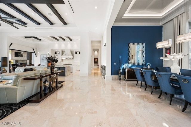 interior space with marble finish floor, visible vents, a ceiling fan, ornamental molding, and baseboards