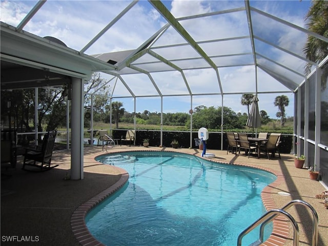 620 Mirror Lakes Falls Ct, Lehigh Acres, FL 33974 - outdoor pool with glass enclosure and a patio area