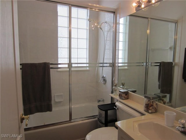 620 Mirror Lakes Falls Ct, Lehigh Acres, FL 33974 - full bath featuring toilet, combined bath / shower with glass door, and vanity