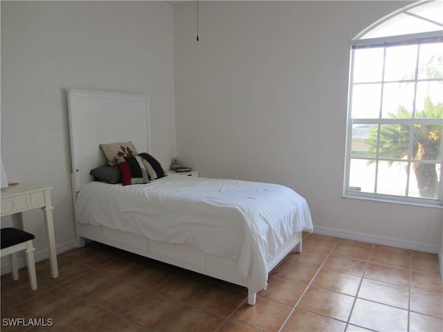 620 Mirror Lakes Falls Ct, Lehigh Acres, FL 33974 - bedroom featuring light tile patterned flooring and baseboards
