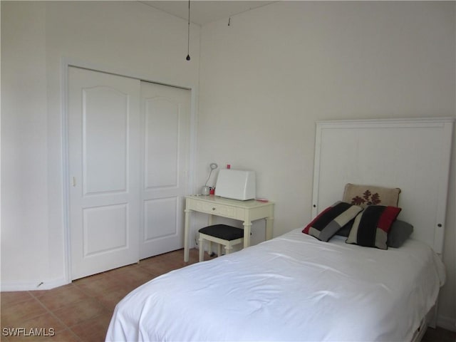 620 Mirror Lakes Falls Ct, Lehigh Acres, FL 33974 - bedroom with a closet and tile patterned floors