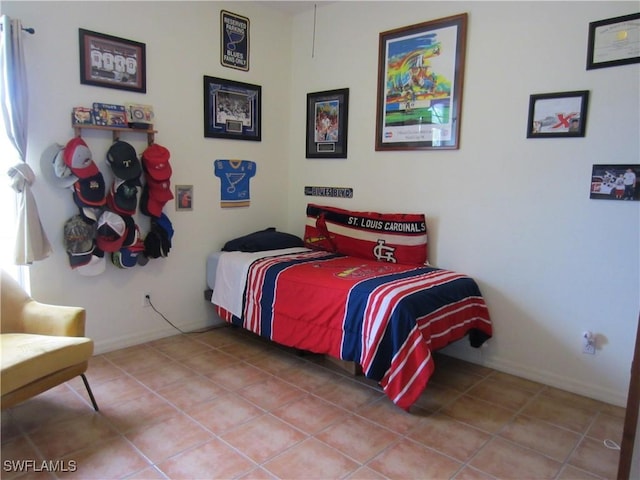620 Mirror Lakes Falls Ct, Lehigh Acres, FL 33974 - bedroom featuring baseboards and tile patterned floors