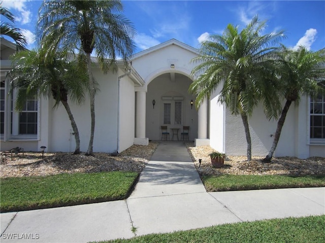620 Mirror Lakes Falls Ct, Lehigh Acres, FL 33974 - doorway to property with stucco siding