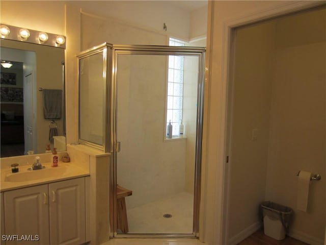 620 Mirror Lakes Falls Ct, Lehigh Acres, FL 33974 - bathroom with a stall shower and vanity