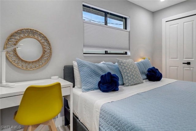 bedroom featuring a closet and built in study area