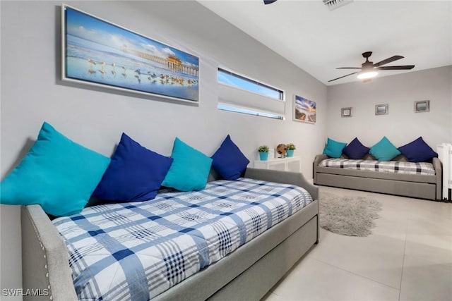 tiled bedroom with ceiling fan and visible vents