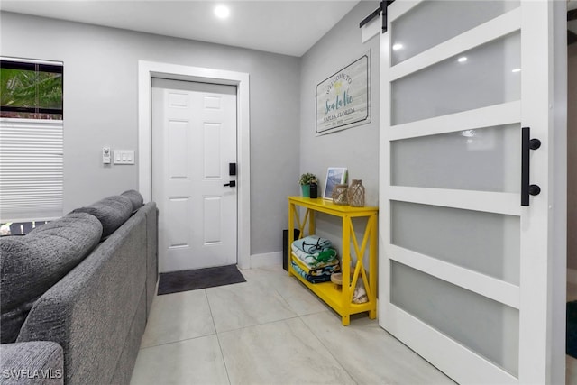 foyer entrance with a barn door