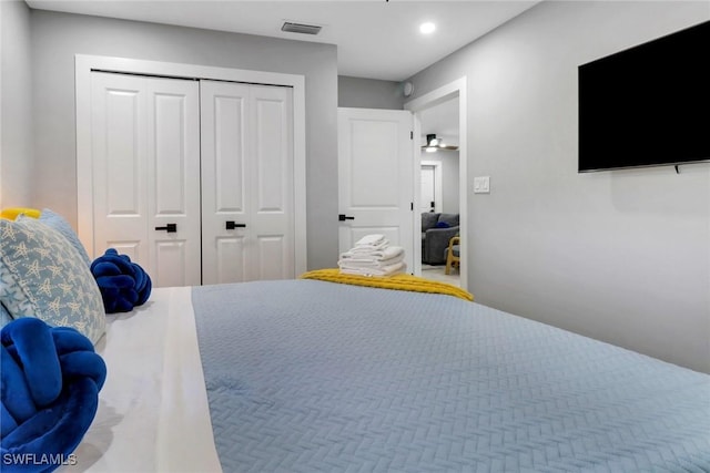 bedroom featuring recessed lighting, a closet, and visible vents