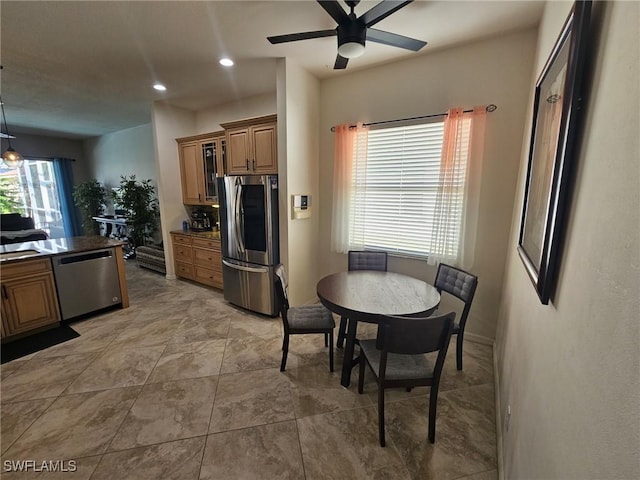 kitchen featuring dark countertops, ceiling fan, stainless steel appliances, and recessed lighting