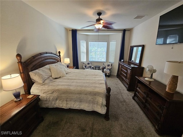 carpeted bedroom featuring ceiling fan and visible vents