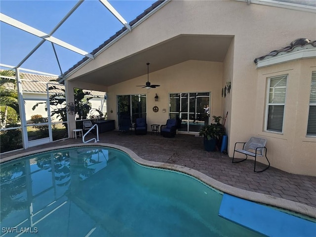 pool with a ceiling fan, a lanai, and a patio