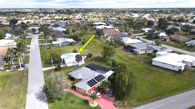 birds eye view of property with a residential view