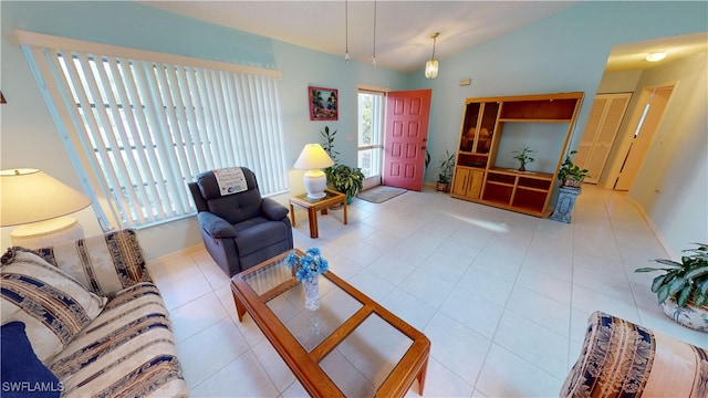 tiled living room with baseboards and vaulted ceiling