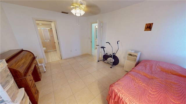 bedroom featuring ensuite bath, visible vents, a ceiling fan, and light tile patterned flooring