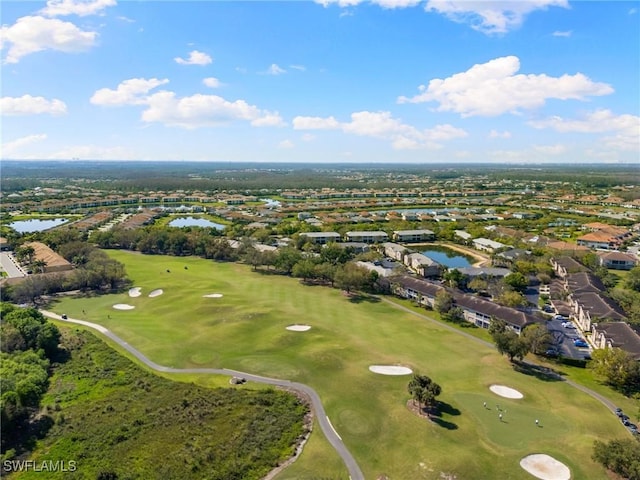 bird's eye view with a water view and golf course view