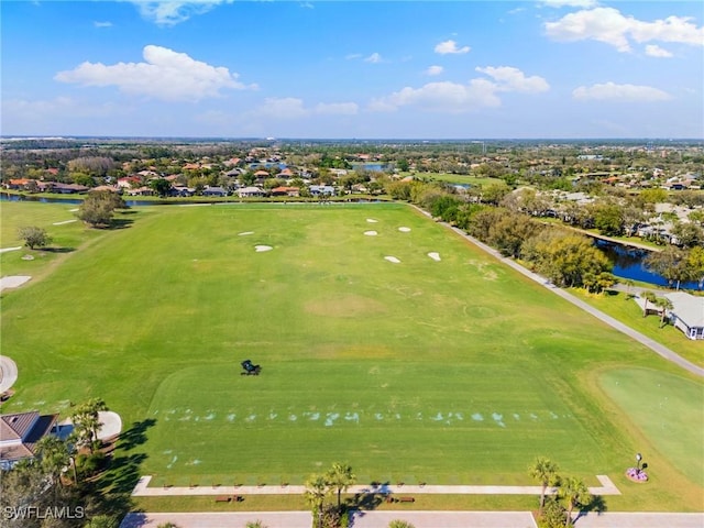 bird's eye view featuring view of golf course and a water view