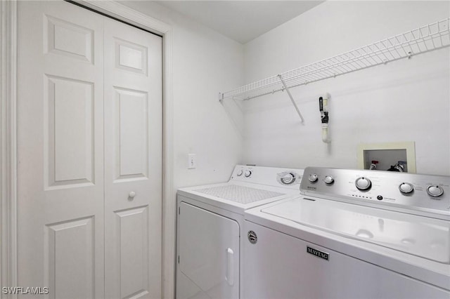 laundry room featuring laundry area and washer and clothes dryer