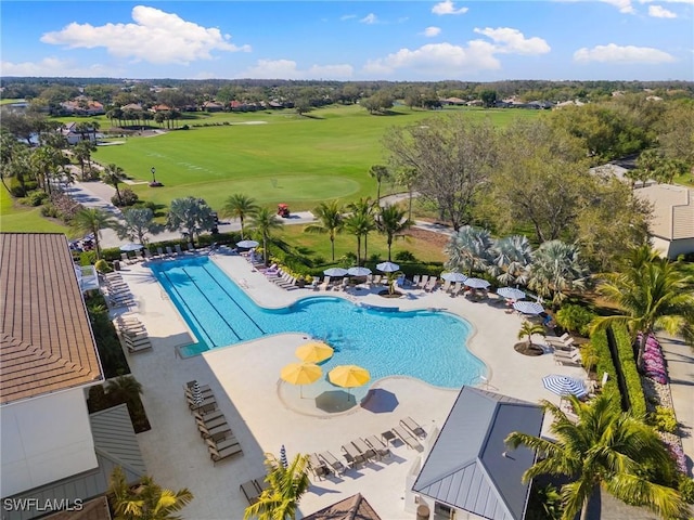 pool featuring a patio area and golf course view