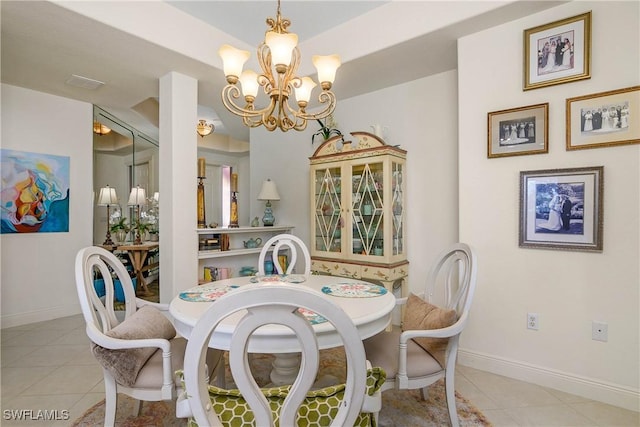 dining area with baseboards, a chandelier, and light tile patterned flooring