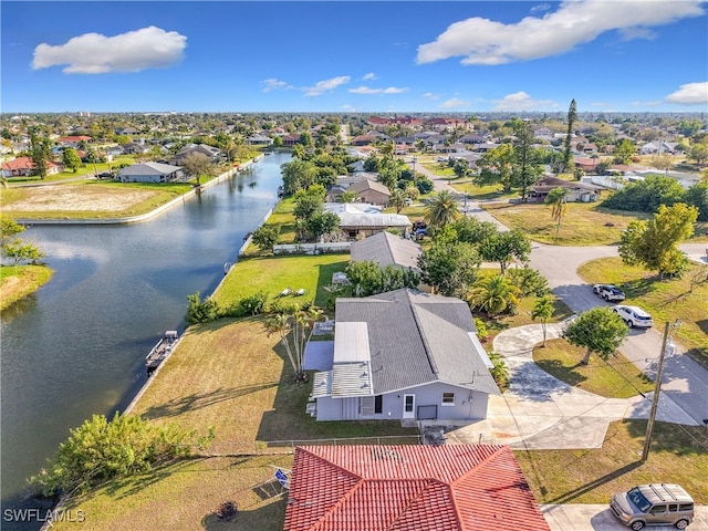 aerial view with a water view and a residential view