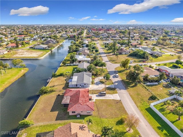 aerial view featuring a water view and a residential view