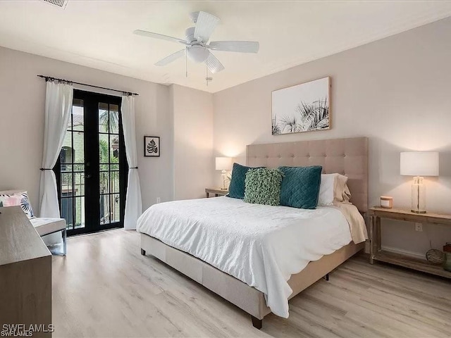 bedroom featuring ceiling fan, access to outside, french doors, and light wood-style flooring